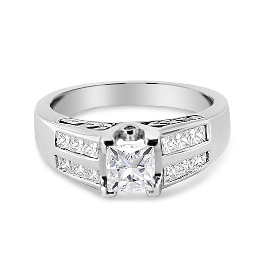 White metal ring with a princess-cut gemstone in the center with invisible setting, flanked by channel-set princess-cut gemstones on both sides, and round bezel-set white gemstones, front angle view.