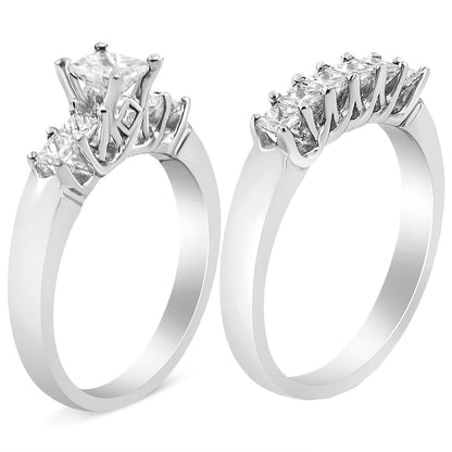 White metal ring with a central princess-shaped white gemstone in prong setting, flanked by smaller princess-shaped white gemstones, shown from a front angled view.