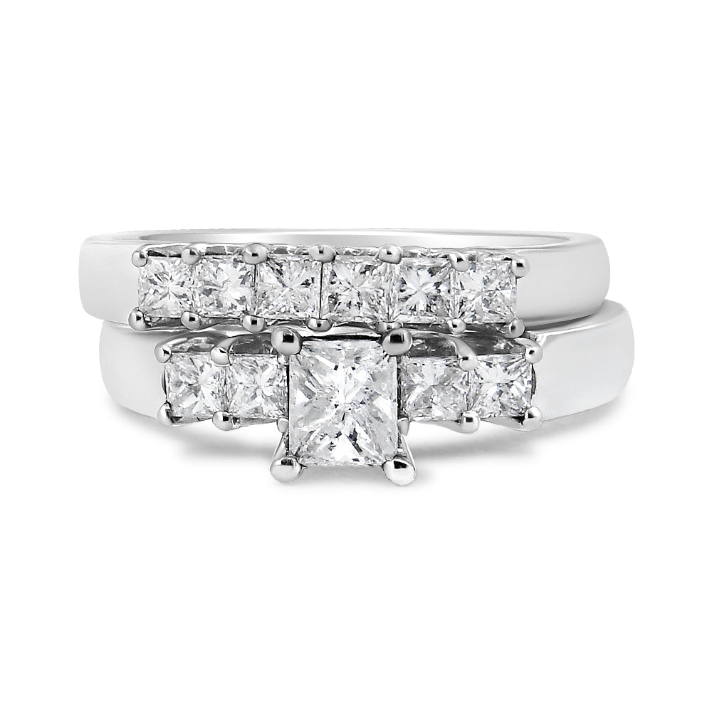 Front angle view of two white metal rings stacked together, each featuring multiple white princess-shaped gemstones in prong settings, with one ring showcasing a larger central gemstone.