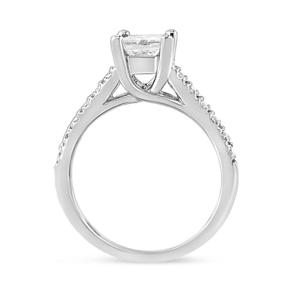 White metal ring shown from side angle with a princess-shaped white gemstone in a four-prong setting and round white gemstones along the band.