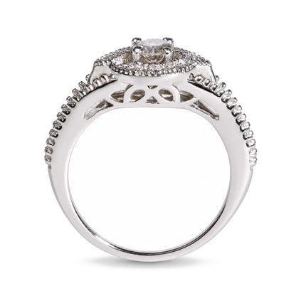 Close-up front angle of a white metal ring with a central round white gemstone in prong setting, surrounded by smaller round white gemstones in prong settings along the band.