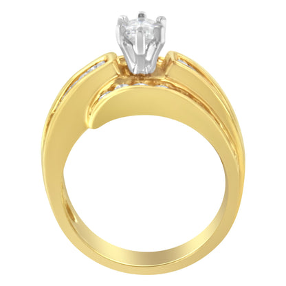 Front view of a yellow and white metal ring featuring a prong-set pie-shaped white gemstone at the center and channel-set baguette and round white gemstones along the band.