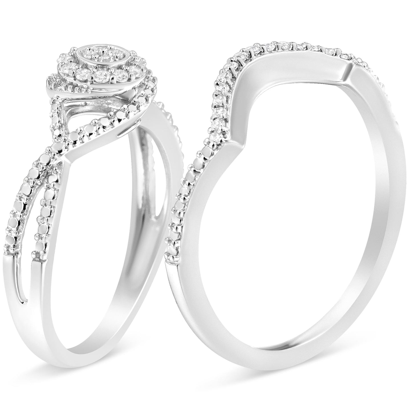 Close-up front angled view of two white metal rings with round white gemstones in prong settings; one ring features a swirl design with gemstones along the band and on top, the other ring has a contoured shape with gemstones along the upper edge.