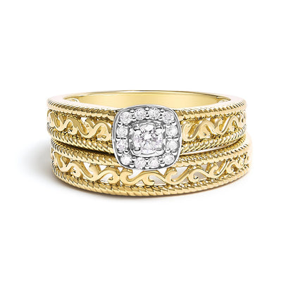 Front view of a yellow ring with intricate swirled detailing on the band, featuring a center white gemstone in a four-prong setting surrounded by smaller white gemstones in prong settings.