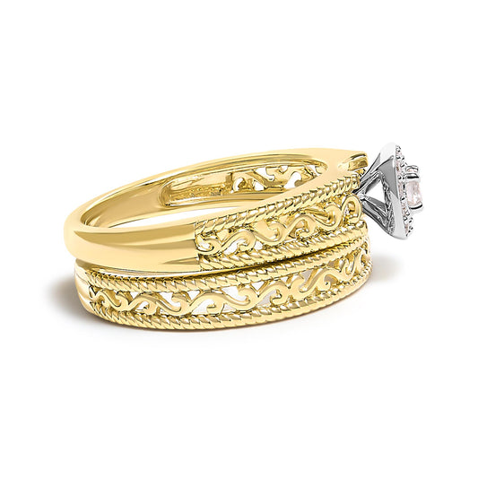 Yellow metal ring with intricate openwork design, featuring a raised white gemstone in a prong setting visible from a side angle.