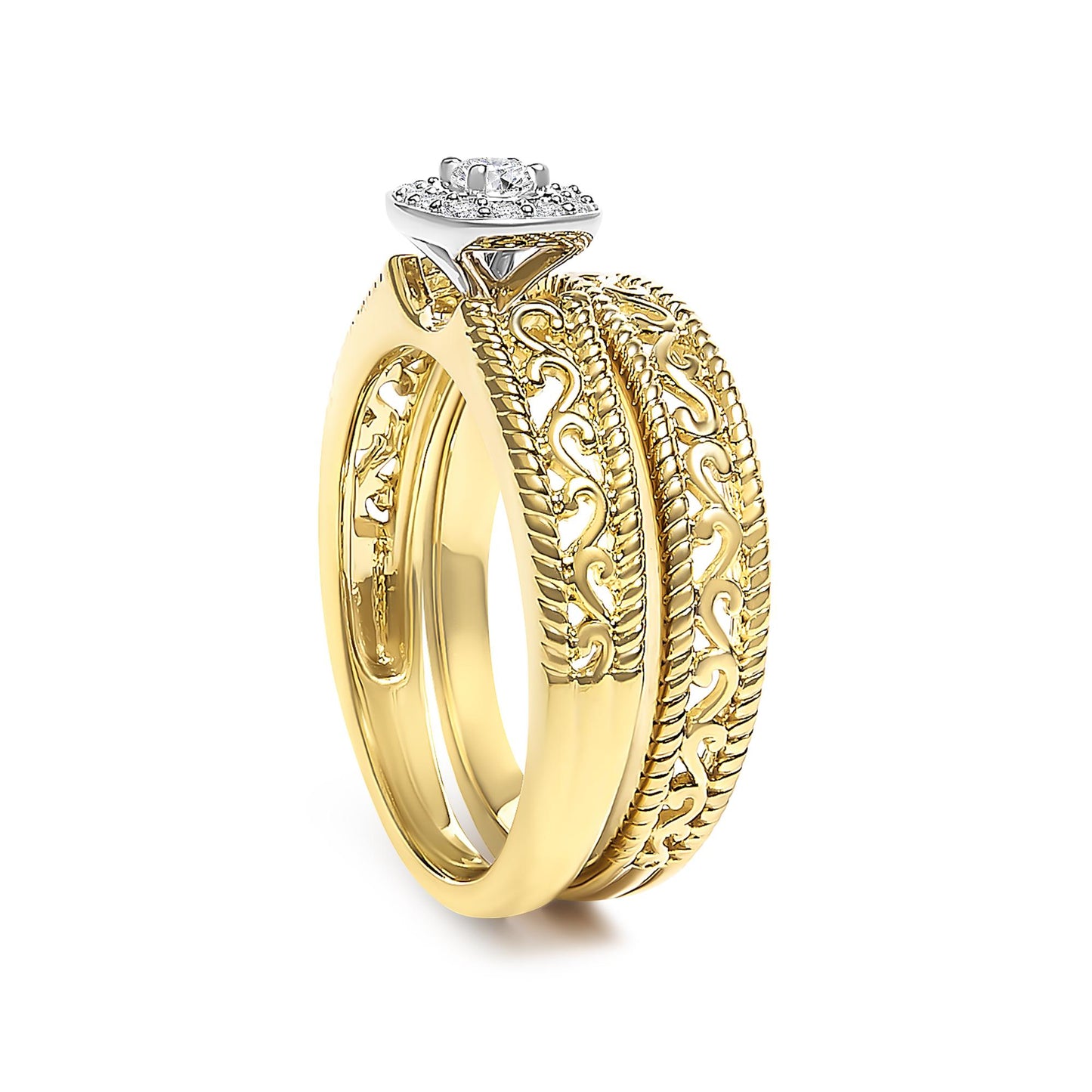 Close-up angled view of a yellow ring set featuring a single round white gemstone in a four-prong setting atop a square-shaped cluster of smaller round white gemstones, accompanied by a yellow ring with an intricate scrollwork pattern.