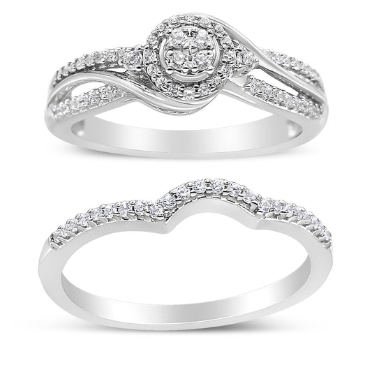 Two white metal rings with round white gemstones in prong settings, shown from the front angle. The top ring features a cluster of gemstones in a central circular design with split shank bands adorned with gemstones. The bottom ring has a contoured shape with a single row of gemstones along the top.