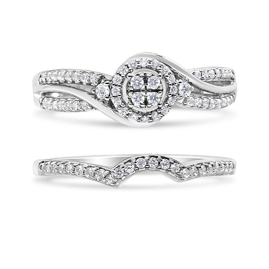 Front angle view of two white metal rings, both featuring round white gemstones in prong settings; the top ring has a twisted band with a cluster centerpiece surrounded by a halo, and the bottom ring has a curved band accented with gemstones.