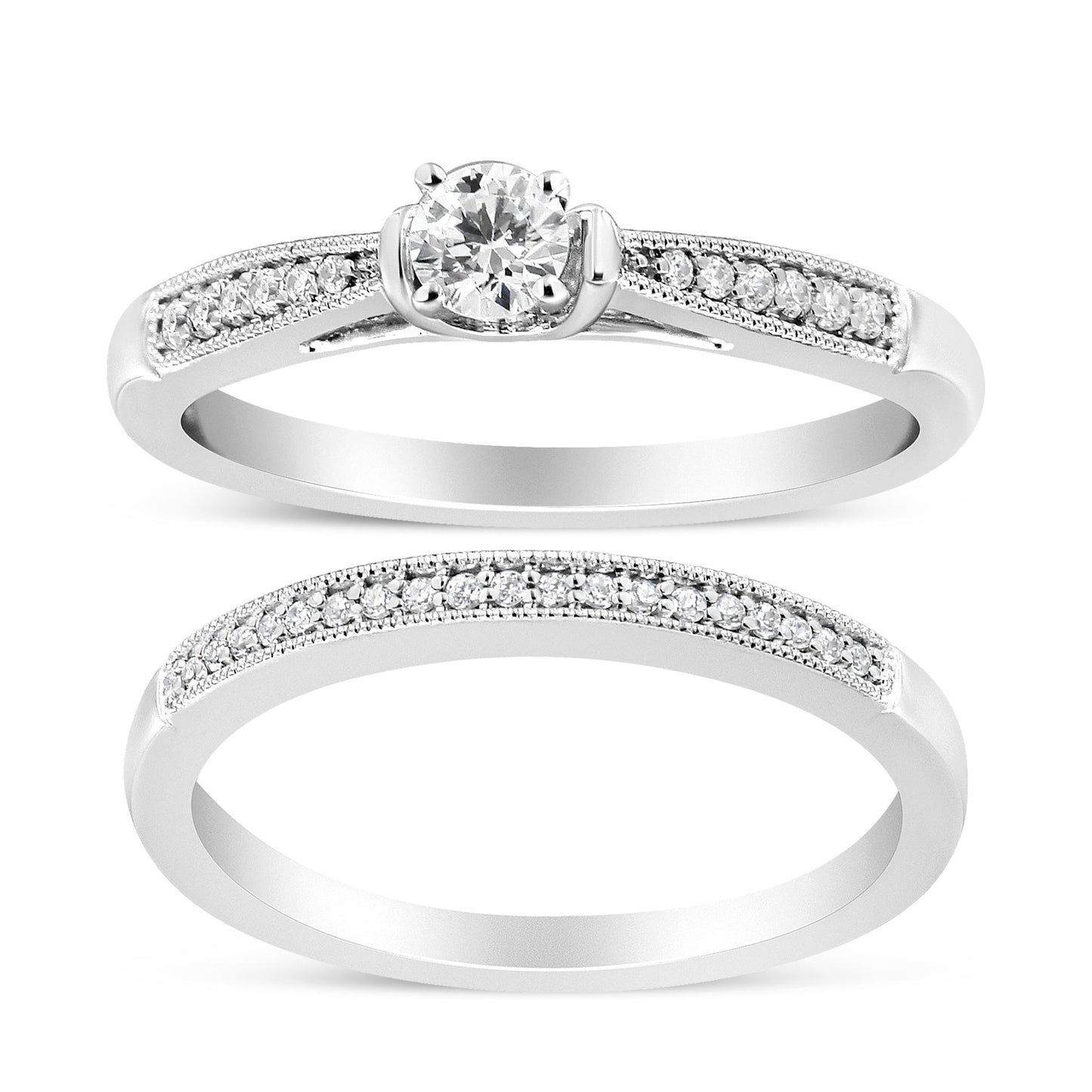 Two white metal rings shown from a front angle; one features a central round white gemstone in a four-prong setting with additional small round white gemstones set along the band, the other is a full eternity style ring with small round white gemstones in a shared prong setting along the band.