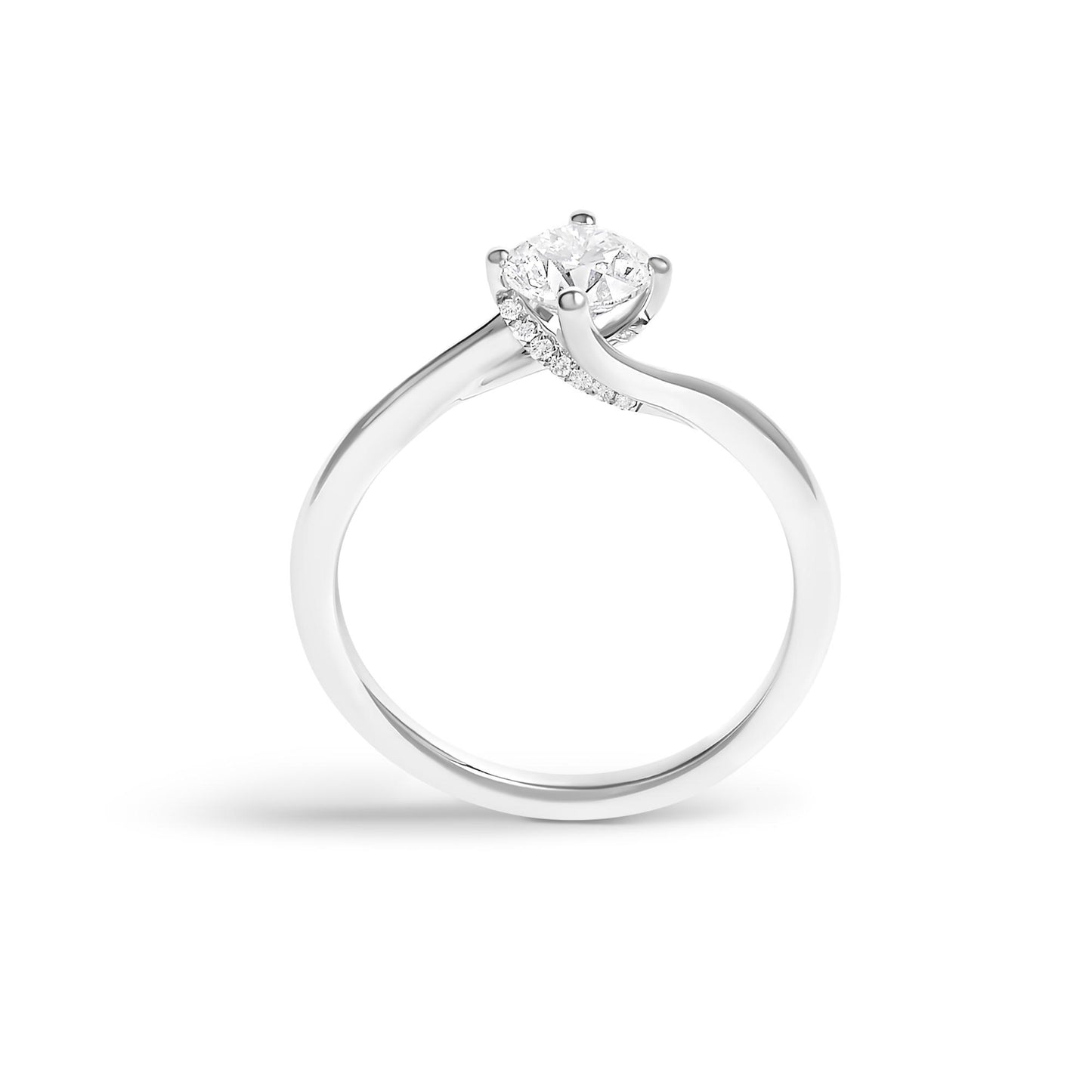 White metal ring viewed from the side, featuring a round white gemstone in a four-prong setting and additional small round white gemstones along the band.