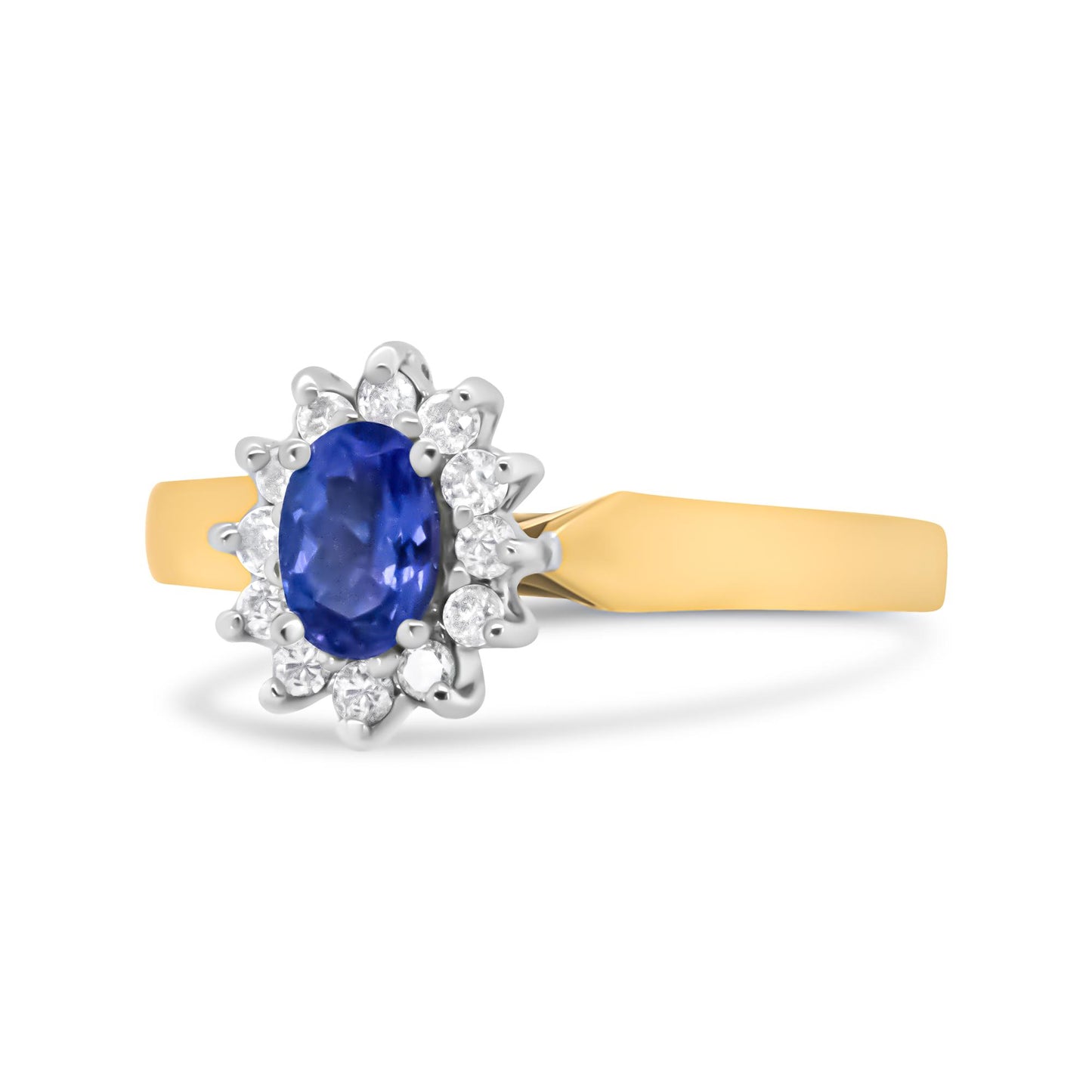 Yellow metal ring with an oval blue gemstone surrounded by round white gemstones in a prong setting, shown from a left side angle.