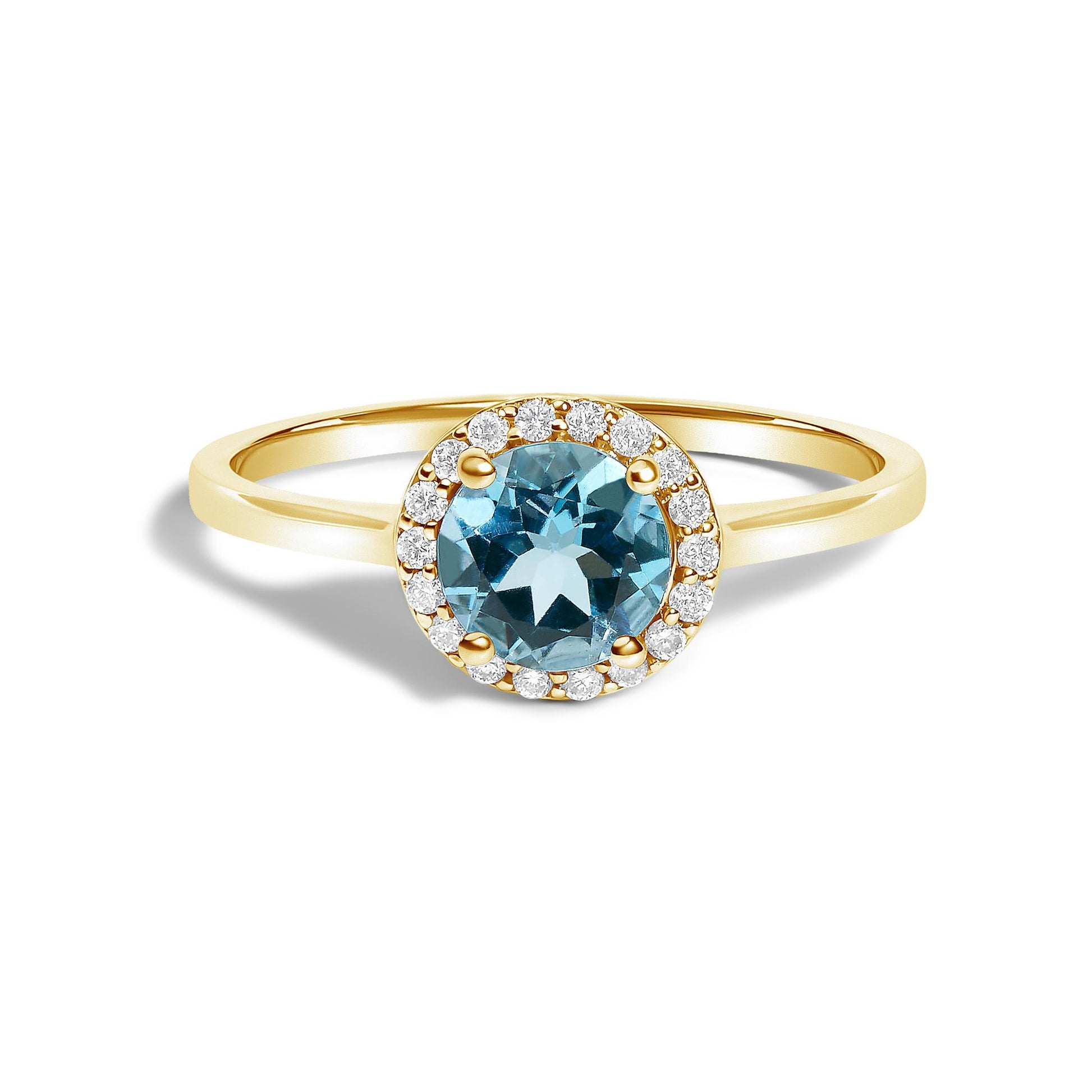 Yellow metal ring with a round blue gemstone in the center surrounded by round white gemstones in a shared prong setting, shown in a front close-up angle.