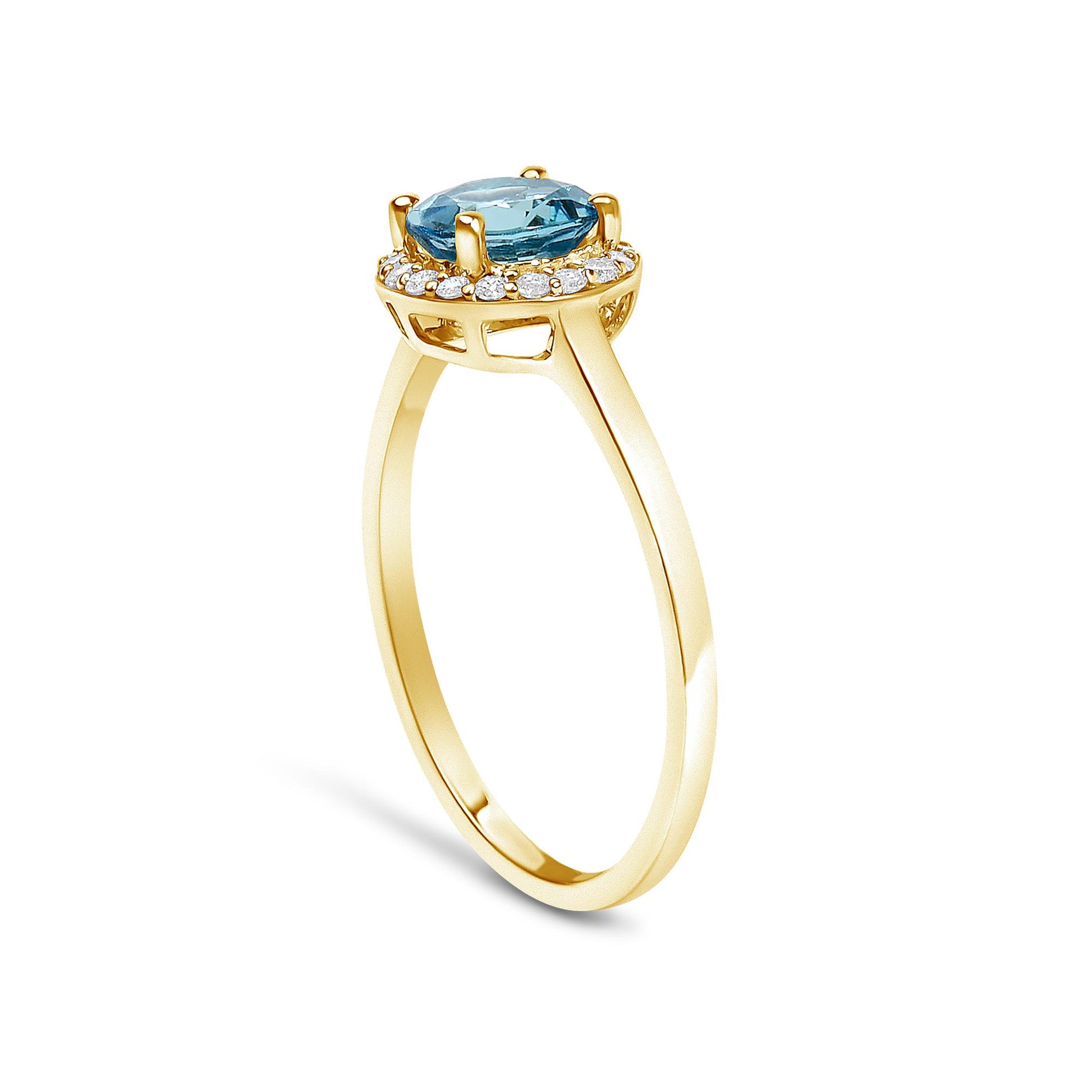 Yellow metal ring shown at a side angle with a round blue gemstone in a four-prong setting surrounded by small white round gemstones in shared prong settings.