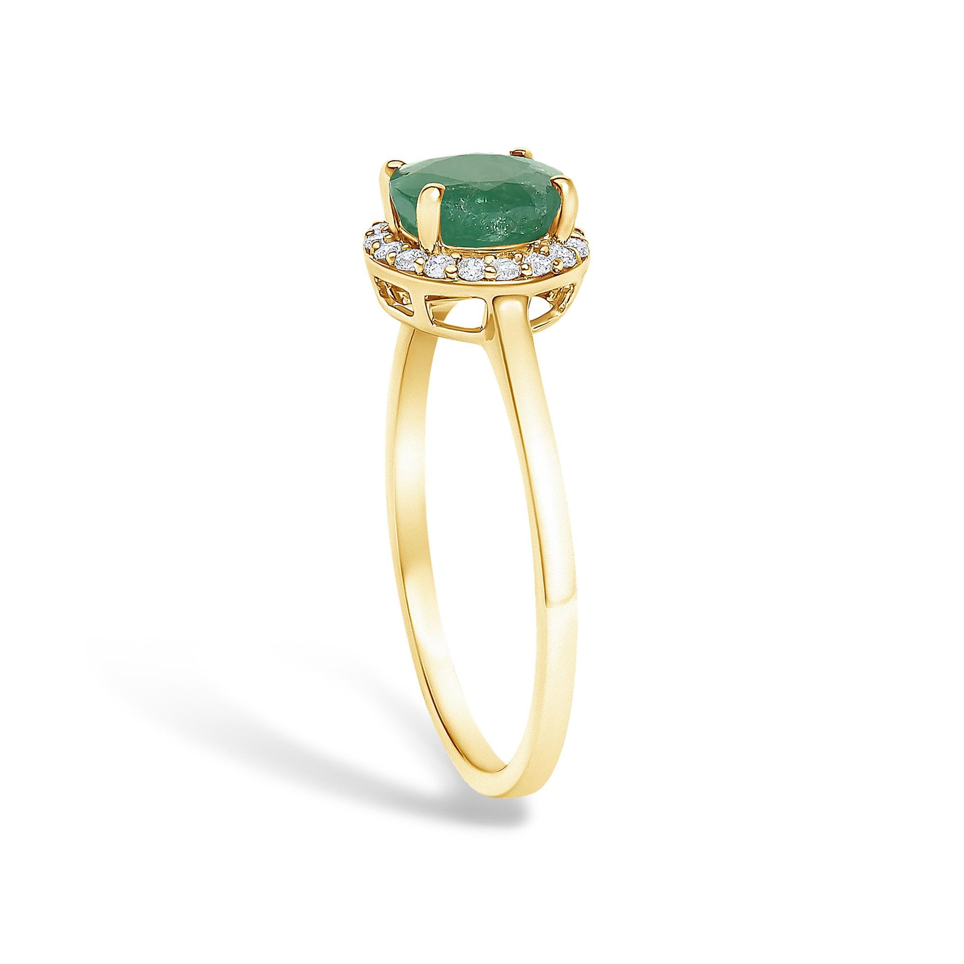 Yellow metal ring shown at a slight angle with a round green gemstone in a four-prong setting surrounded by small round white gemstones in a shared prong setting.
