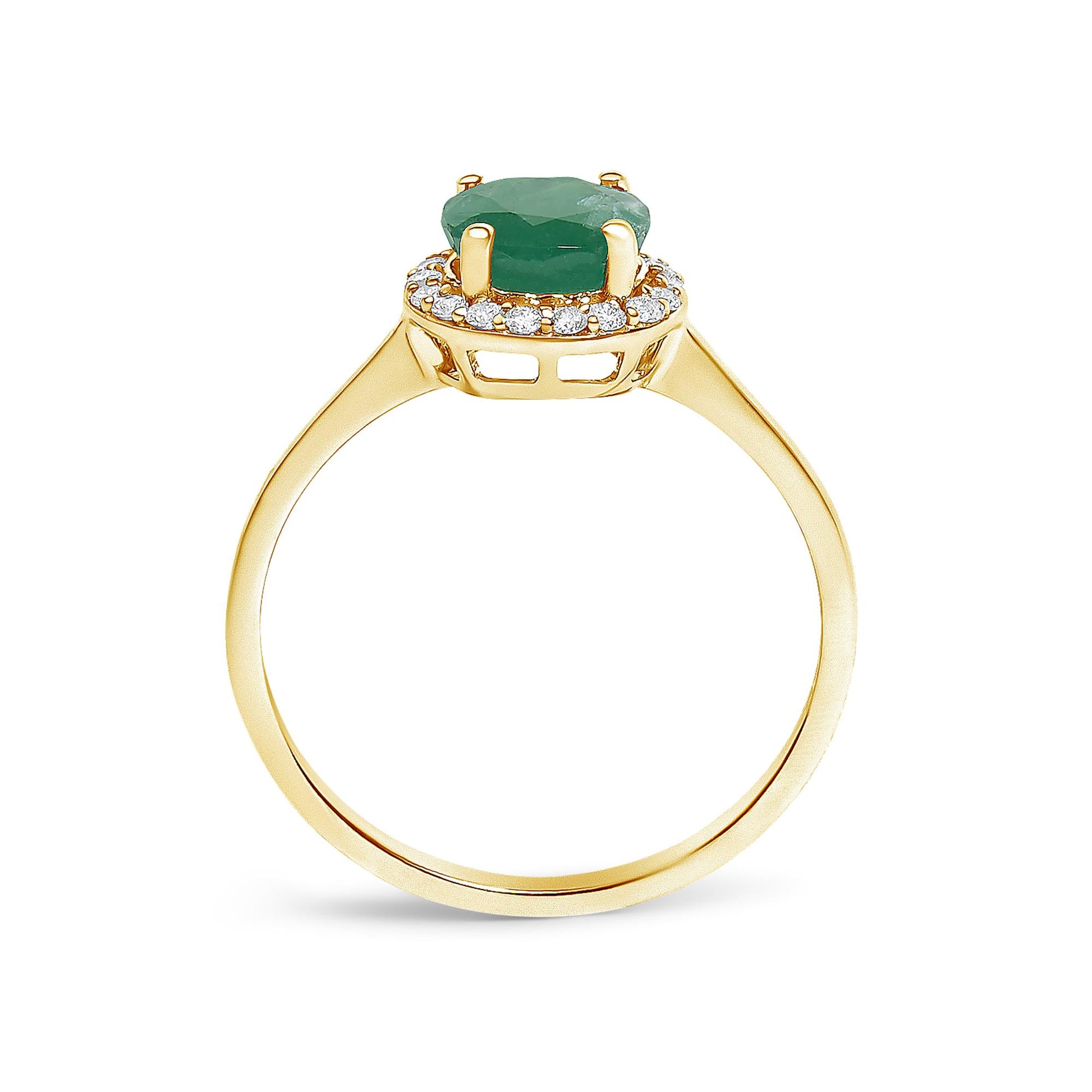 Yellow metal ring shown from the side angle with a green round gemstone in a four-prong setting surrounded by a halo of white round gemstones in a shared prong setting.