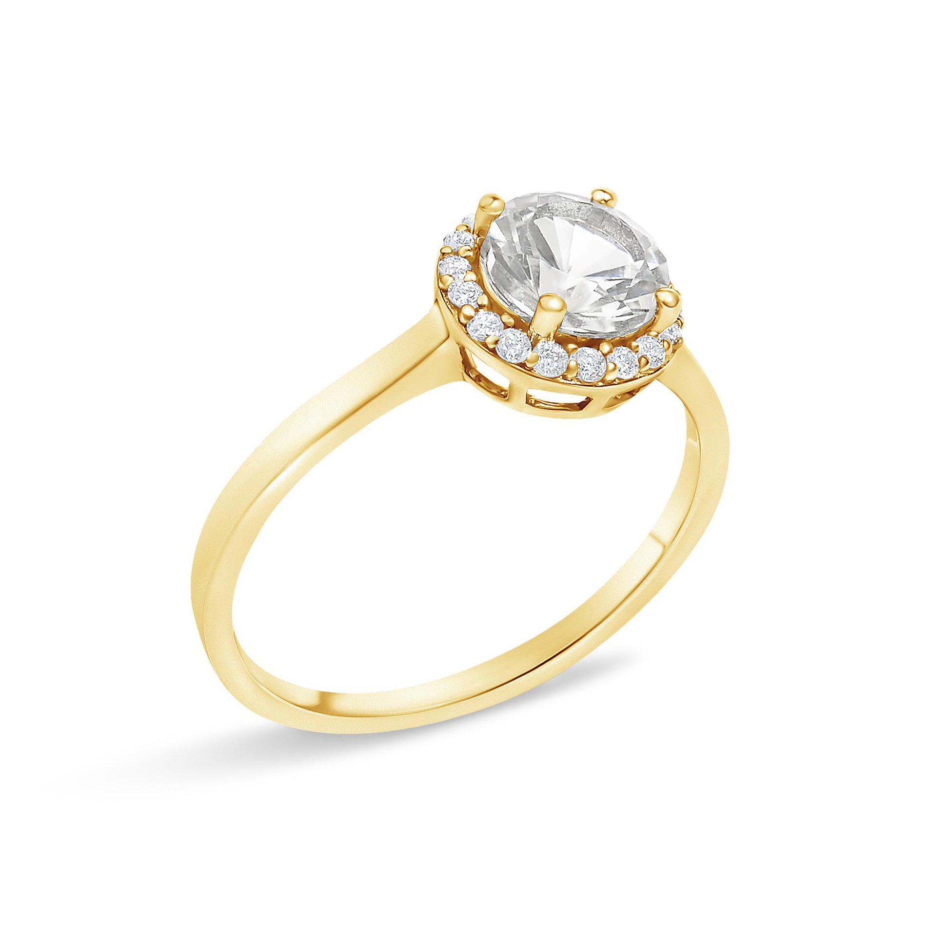 Yellow metal ring with a round white central gemstone in a four-prong setting, surrounded by a halo of round white gemstones in shared prong settings, shown at an angled side view on a white background.