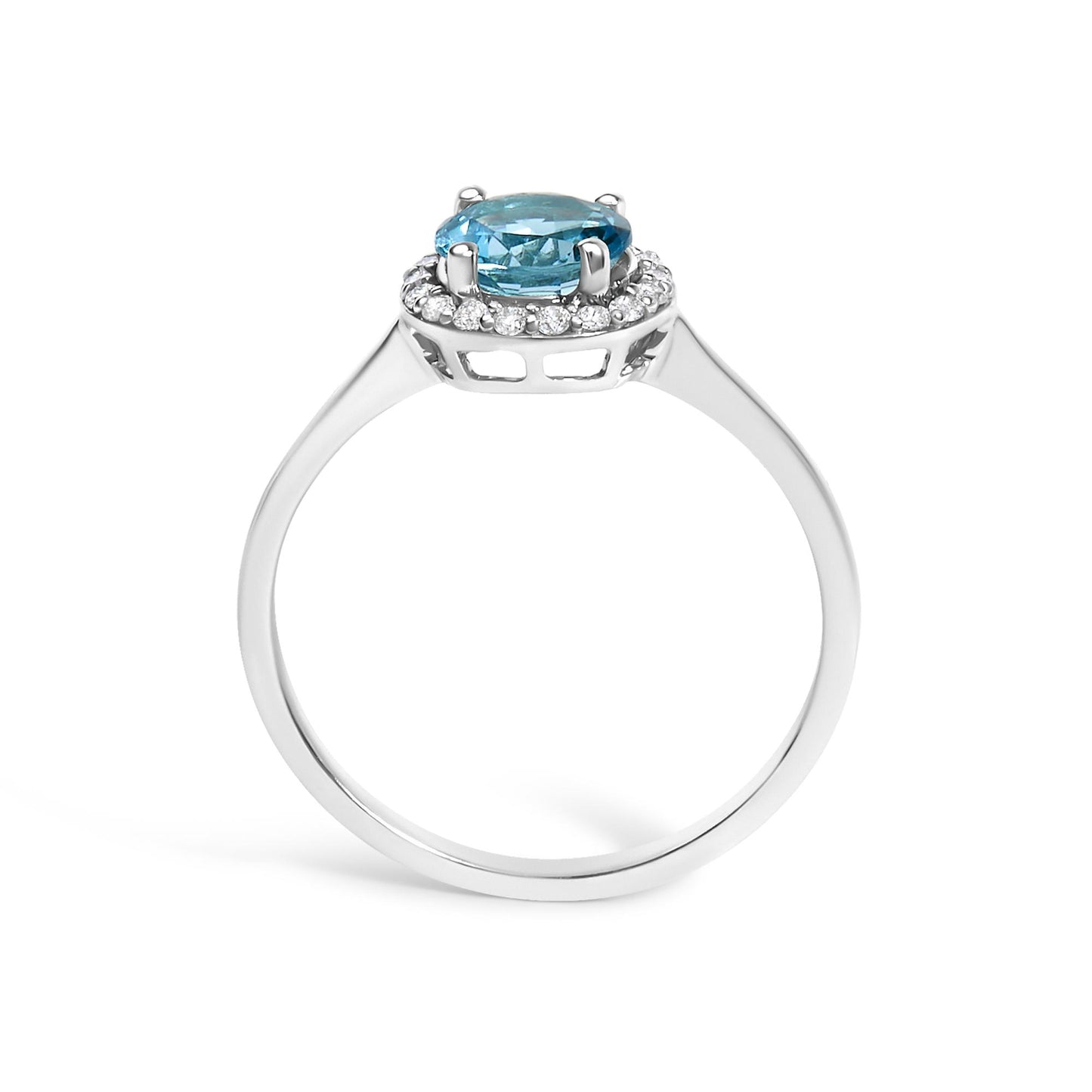 White ring with a round blue gemstone in a four-prong setting, surrounded by small round white gemstones in a shared prong setting, shown from the front angle.