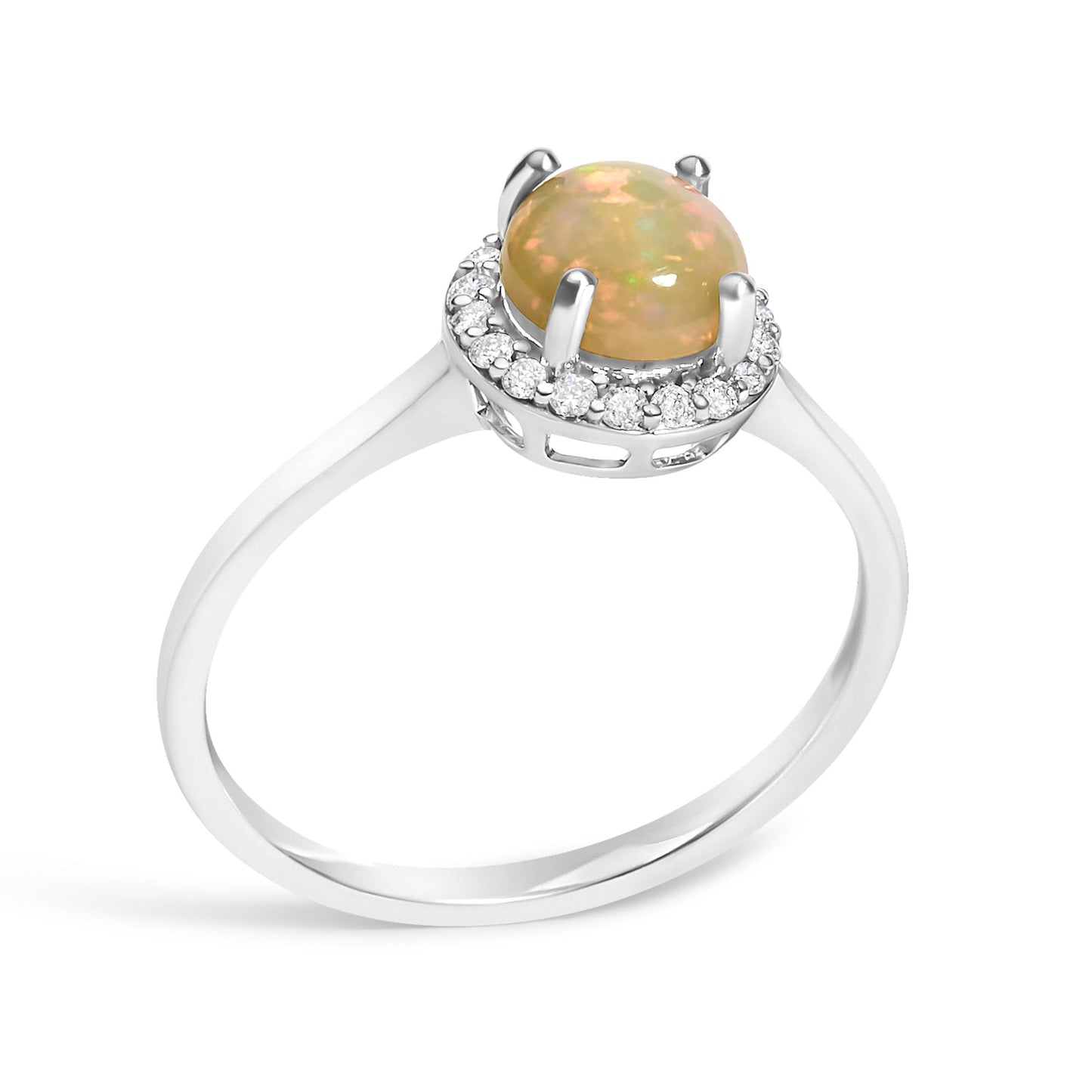 White metal ring with a central round multi-color opal gemstone in a four-prong setting, surrounded by a halo of round white gemstones in shared prong settings, shown from an angled side view.