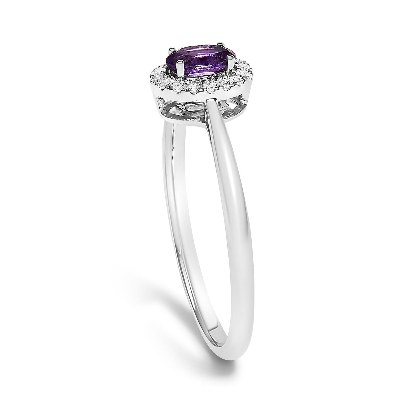 Close-up angled view of a white metal ring featuring a purple oval gemstone set with prongs, surrounded by a circle of small white round gemstones in a micro-pave setting.