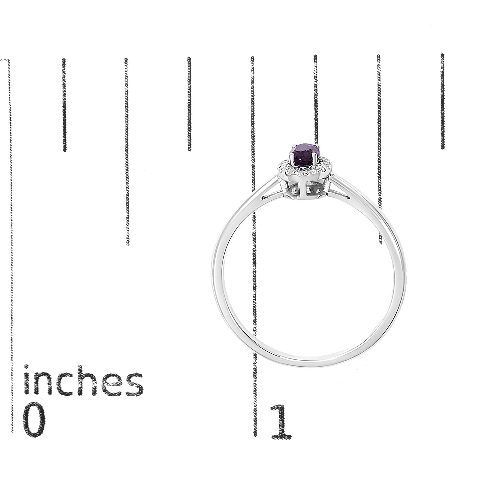 White metal ring with an oval purple gemstone in a prong setting surrounded by small white gemstones in a micro-pave setting, shown on a scale from a top side angle.