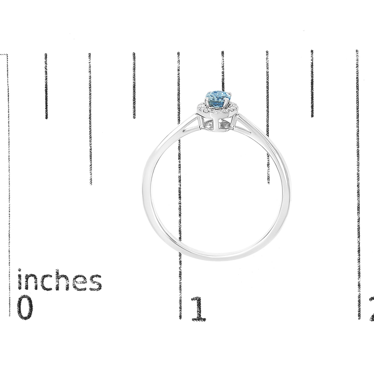 White metal ring with an oval blue gemstone in a prong setting, surrounded by small round white gemstones in a micro-pave setting, shown from the side on a scale.