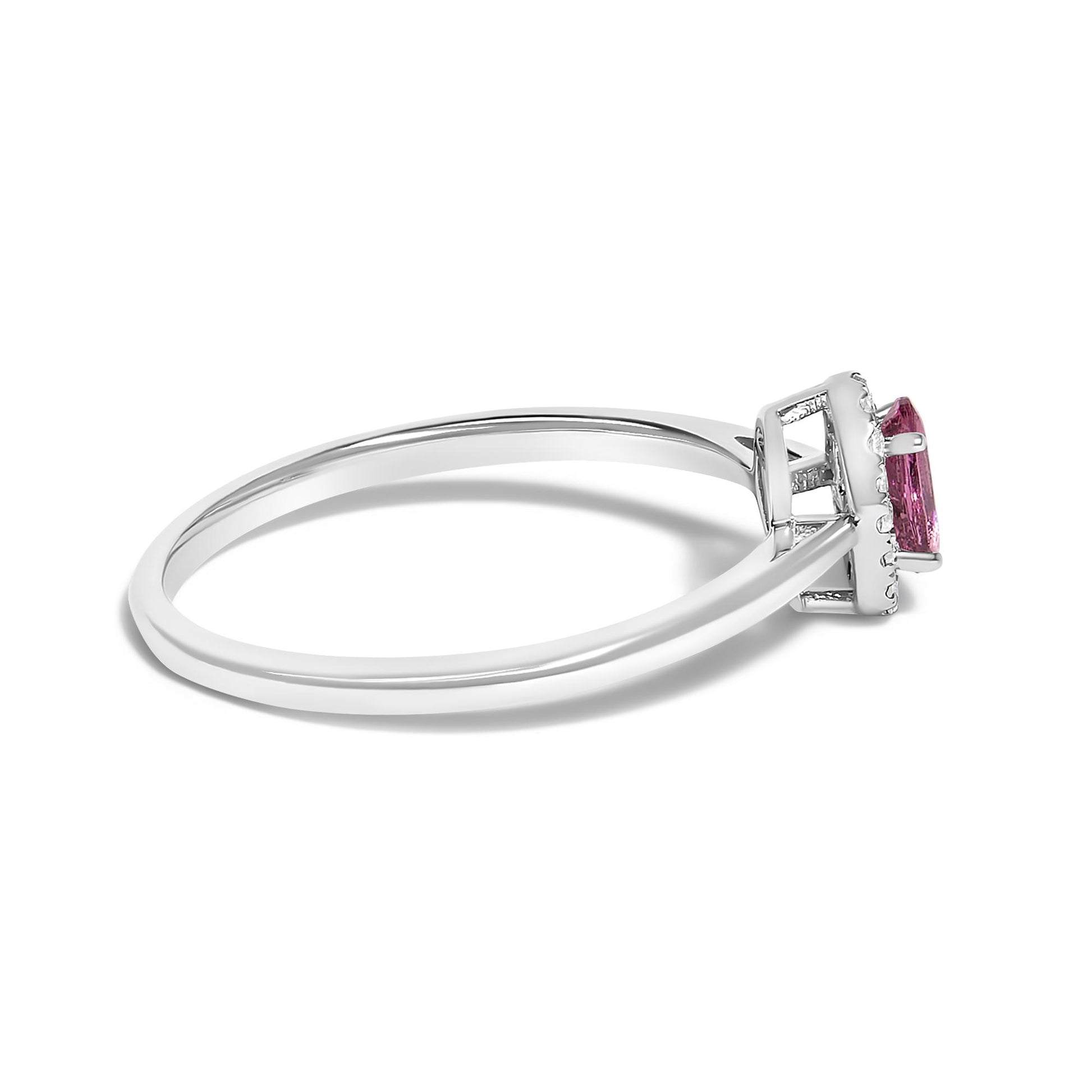Side angle view of a white metal ring featuring a pink oval gemstone set with prongs, surrounded by small white round gemstones in a micro-pave setting.