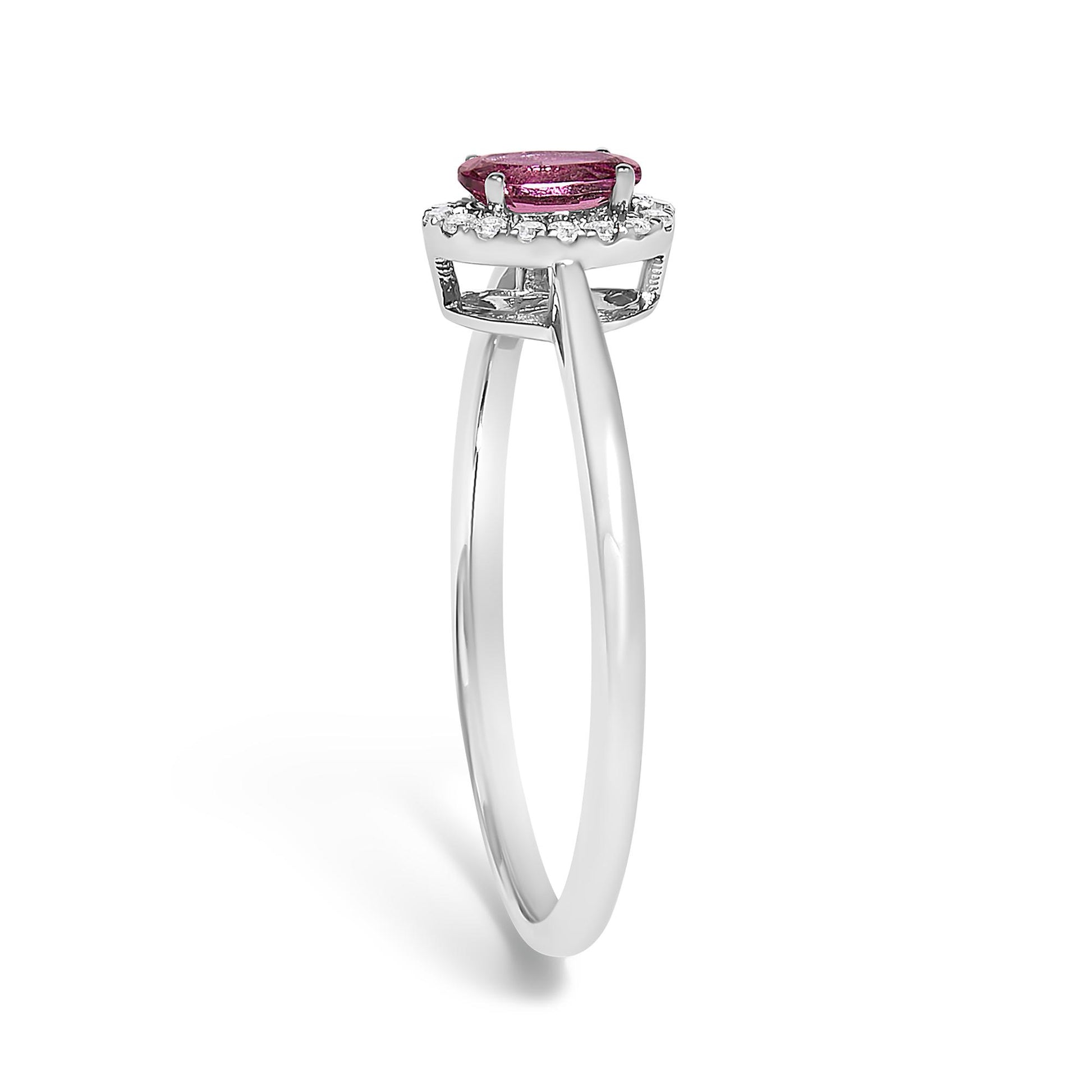 Side angle view of a white ring featuring a pink oval gemstone set with prongs, surrounded by small white round gemstones in a micro-pave setting.