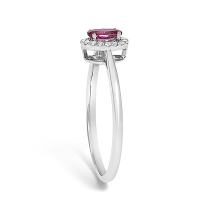 Side angle view of a white ring featuring a pink oval gemstone set with prongs, surrounded by small white round gemstones in a micro-pave setting.