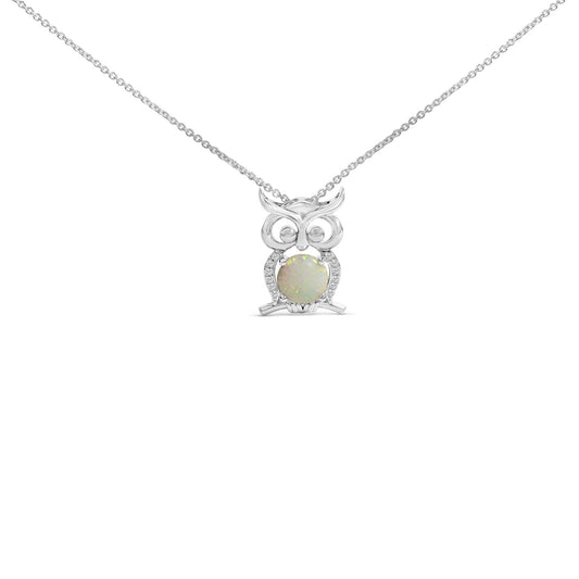 Front view of a white metal owl-shaped necklace pendant featuring a round white opal gemstone at the center held by four prongs, surrounded by small round white gemstones in prong settings, shown on a white background.