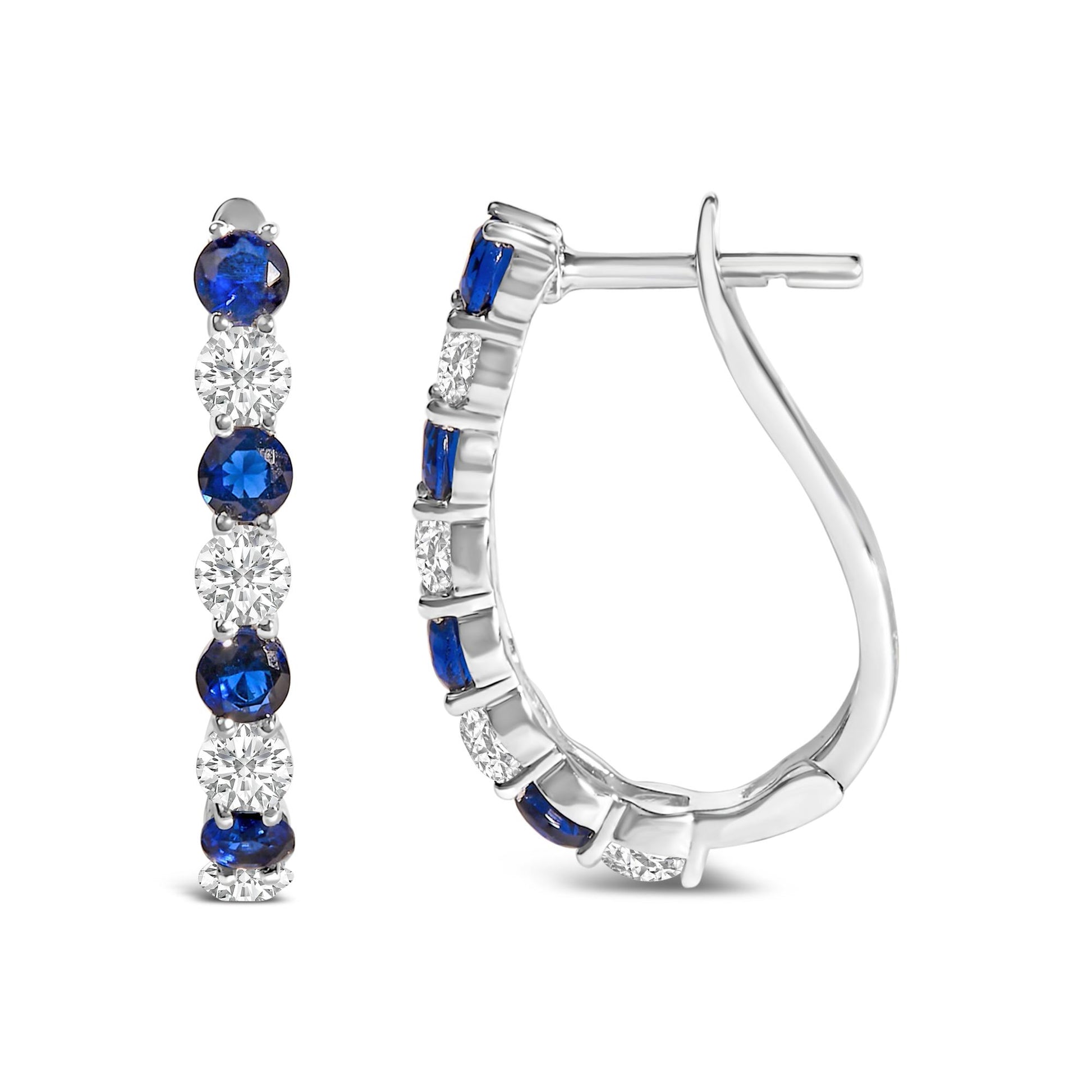 Front and side views of a pair of white metal hoop earrings with alternating blue and white round gemstones in shared prong settings, shown on a white background.