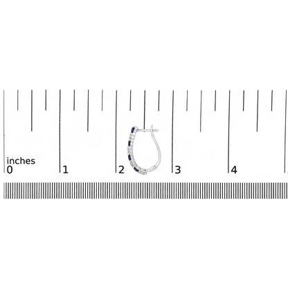 White metal hoop earring with alternating blue and white round gemstones in shared prong setting, shown on a scale from a side angle.