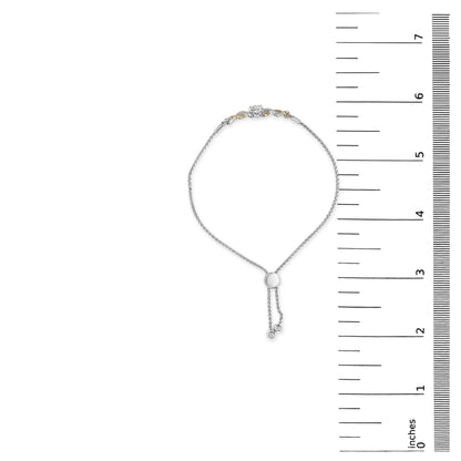Bracelet with yellow and white metal links featuring round white gemstones in prong settings, shown flat on a scale with measuring marks, top-down view.