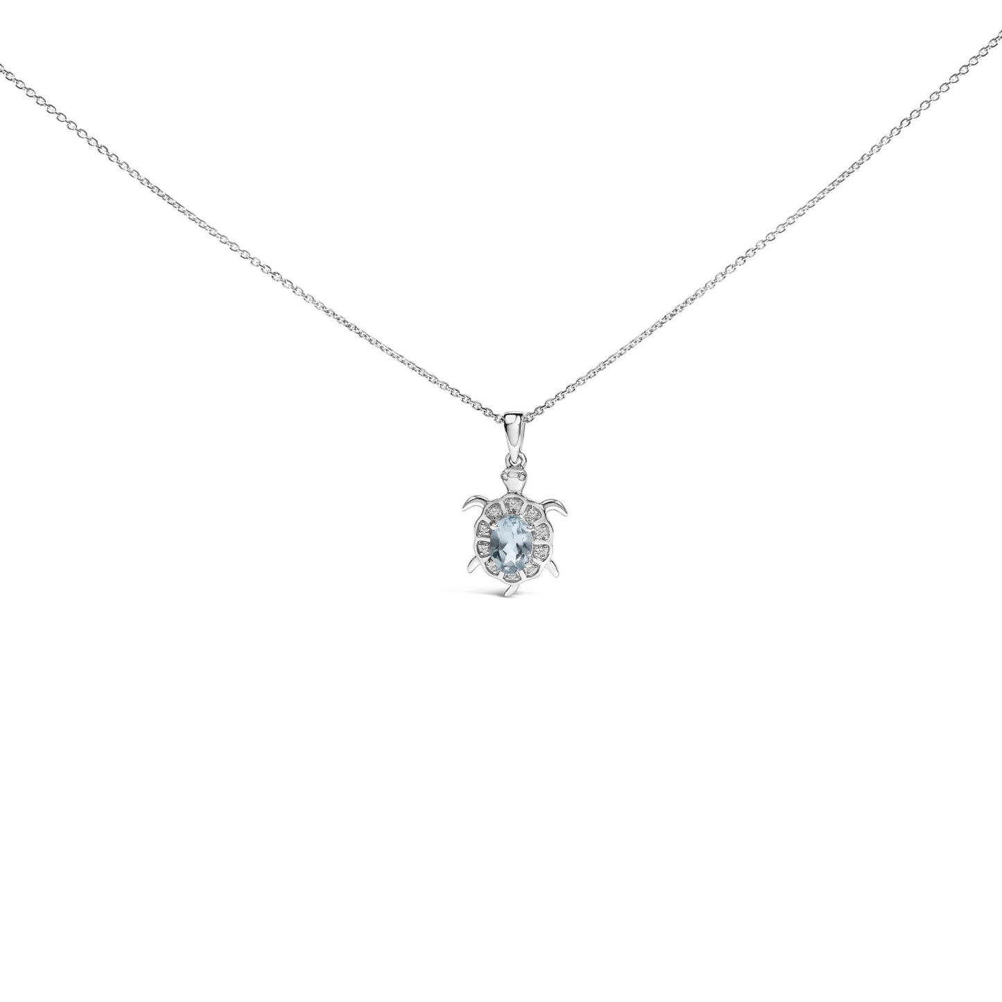 White metal necklace with turtle-shaped pendant featuring an oval blue gemstone at the center surrounded by round white gemstones, shown front-facing on a white background.