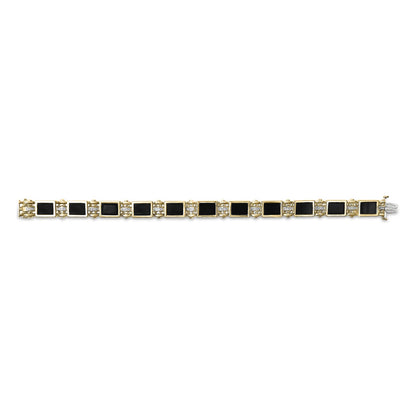 Yellow metal bracelet with alternating rectangular black gemstones in bezel settings and clusters of small round white gemstones in pave settings, shown flat from a top-down angle.