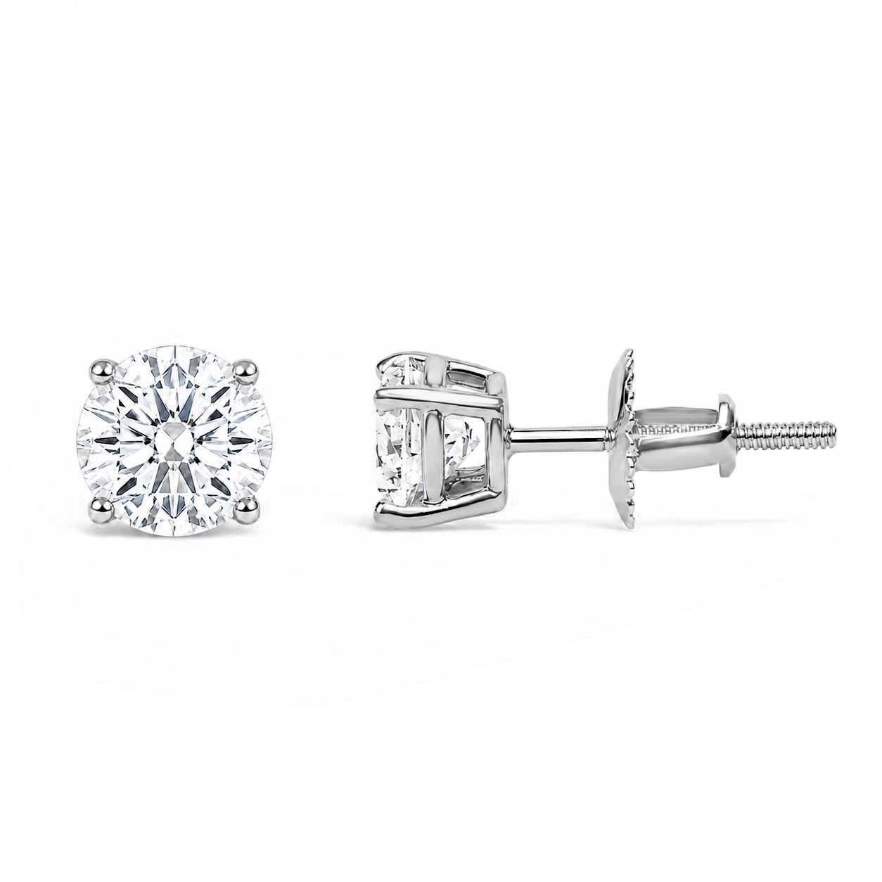 Front and side view close-up of a pair of white metal stud earrings each set with a round white gemstone in a four-prong setting, shown against a white background.