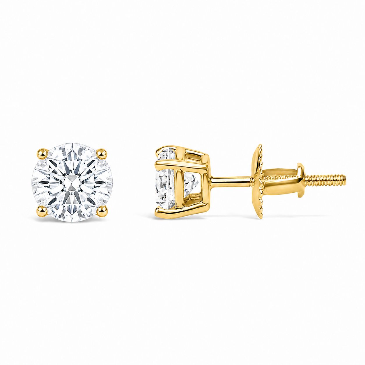 Pair of yellow metal stud earrings with round white gemstones in 4-prong settings, shown in a front and side angle on a white background.
