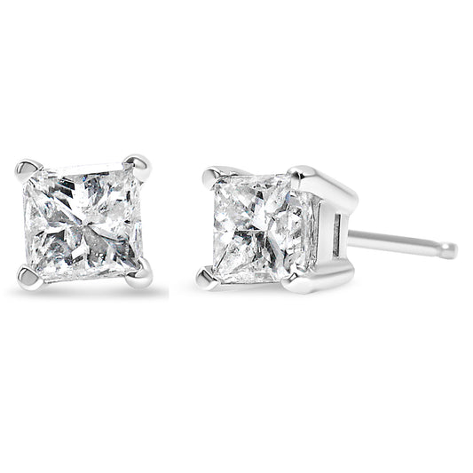 Close-up front and side view of white metal stud earrings with square-shaped brownish gemstones in four-prong settings.
