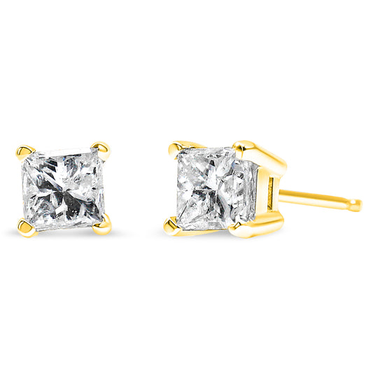 Pair of yellow metal stud earrings with princess-shaped white gemstones in four-prong settings, shown from front and side angles on a white background.