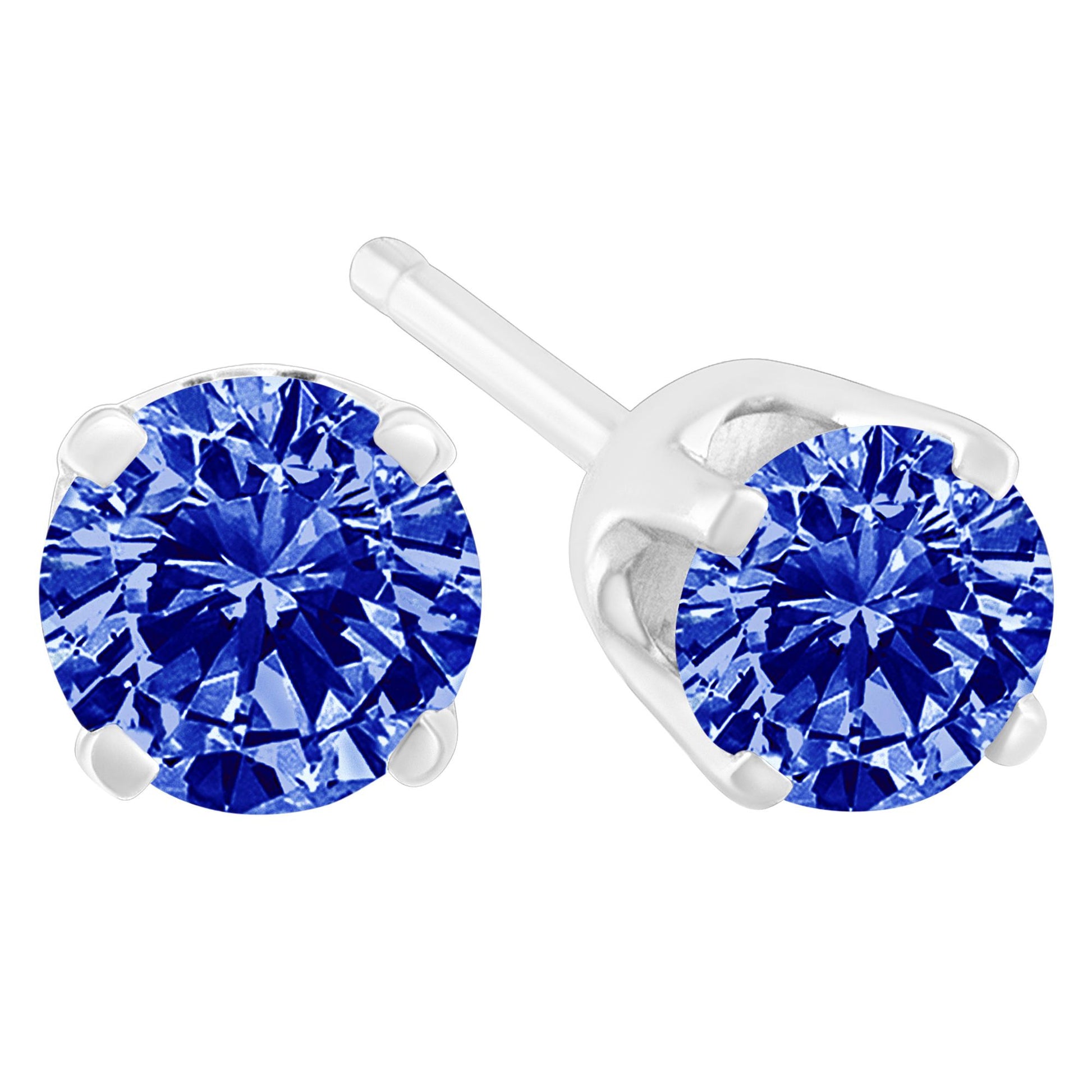 Pair of white metal stud earrings with round blue gemstones in prong settings, shown from a close-up front and side angle.