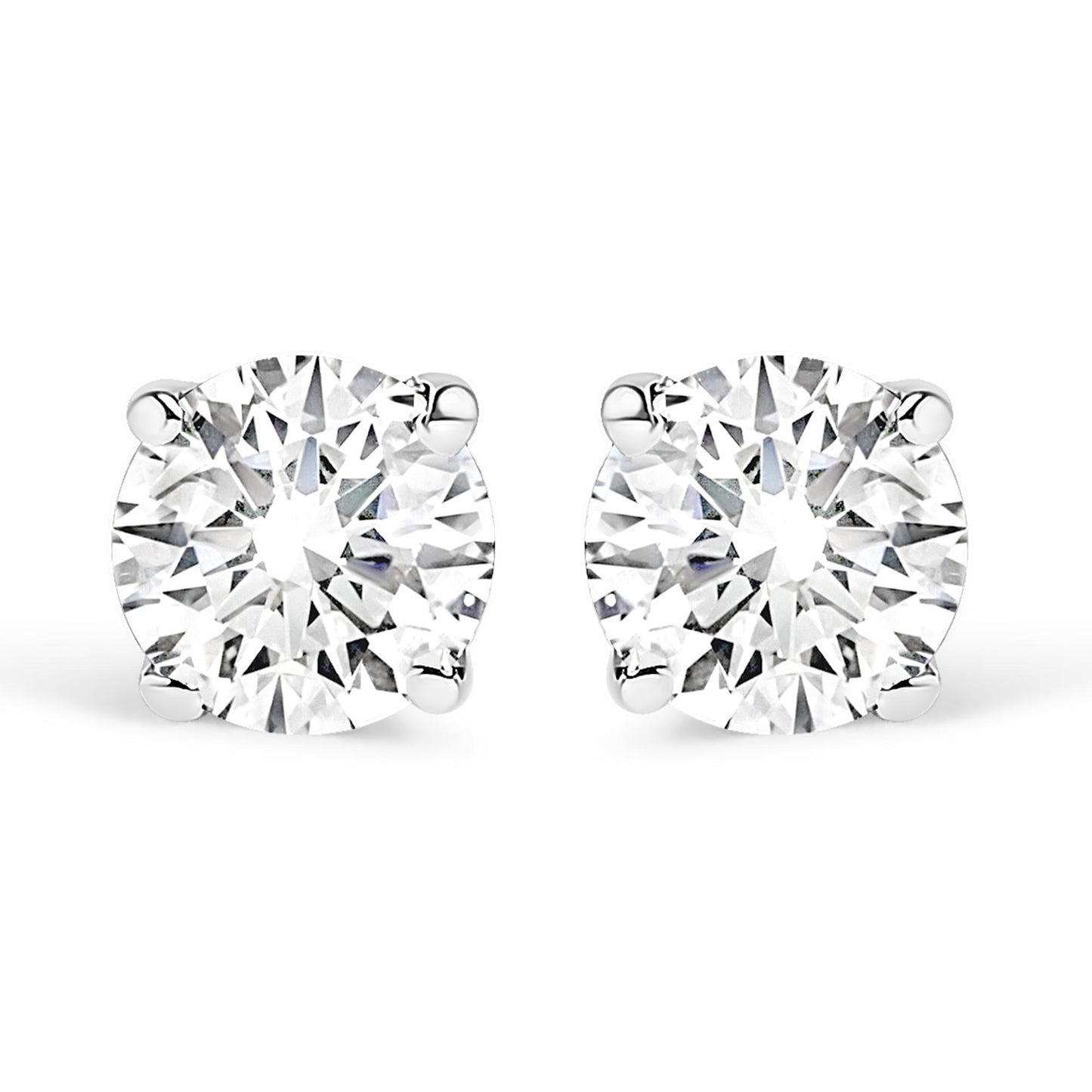 Front-facing close-up of a pair of white stud earrings each set with a round white gemstone in a four-prong setting.