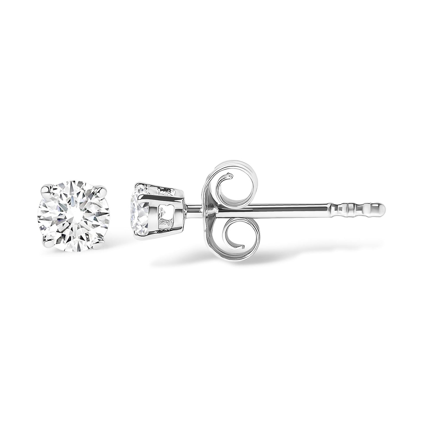 Close-up side view of white metal stud earrings with round white gemstones in 4-prong settings.