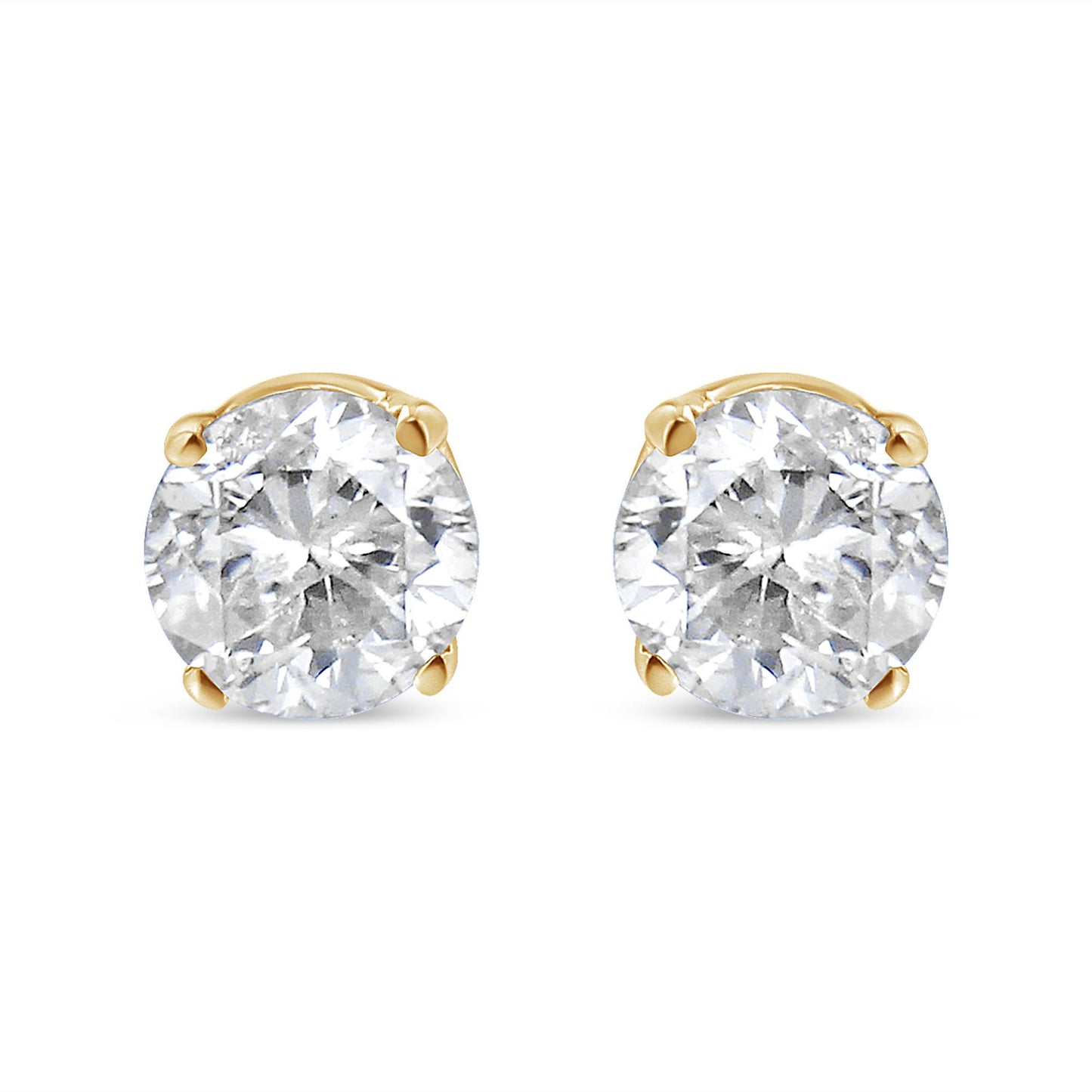 Pair of yellow metal stud earrings with round white gemstones in 4-prong settings, shown from a front angle.