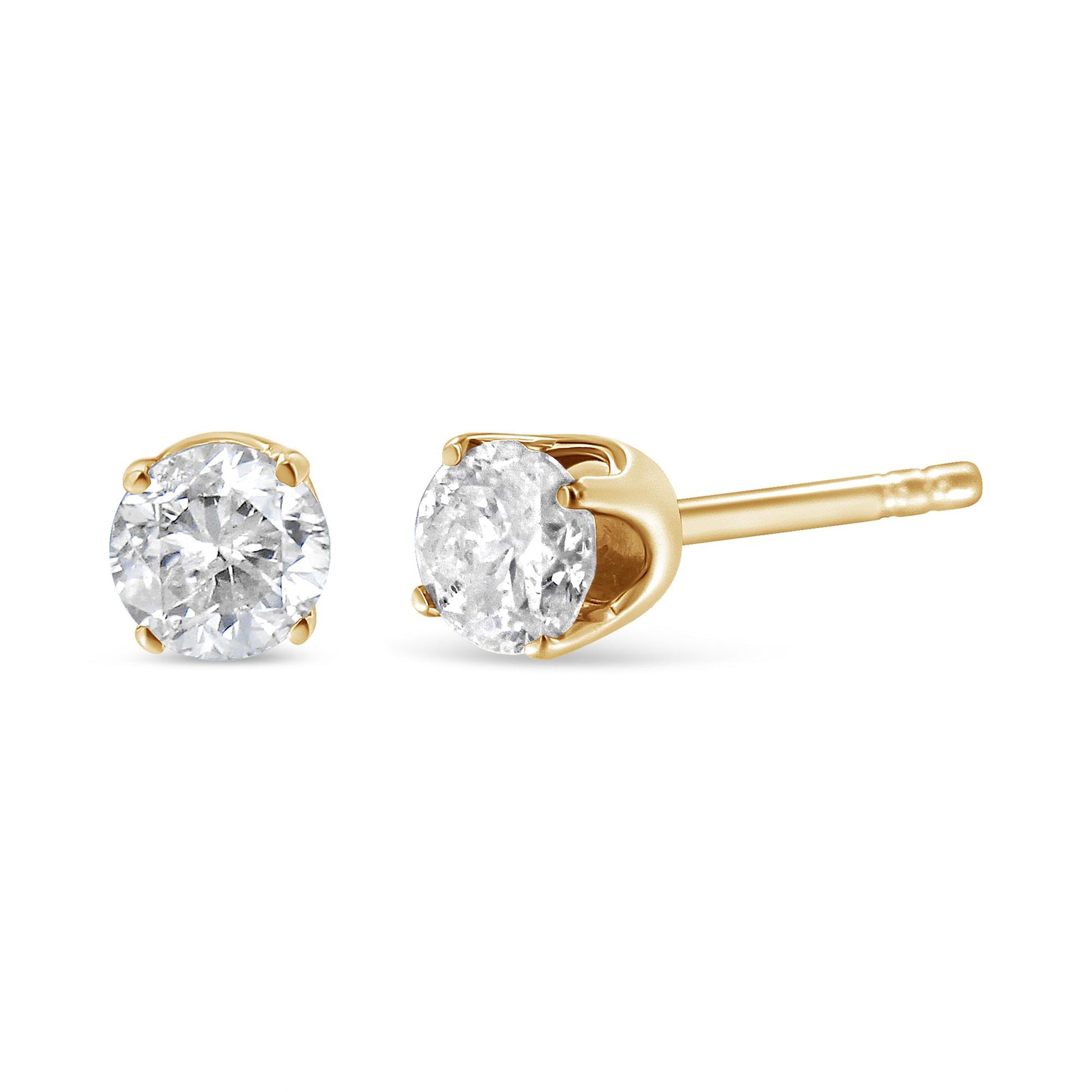 Pair of yellow metal stud earrings with round brownish gemstones in 4-prong settings, shown from front and side angles.