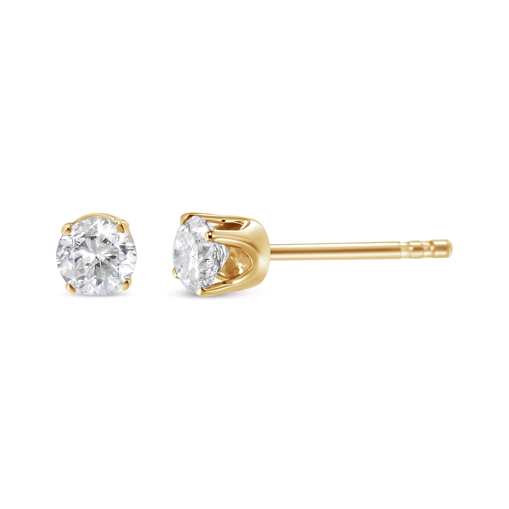 Close-up side and front view of yellow metal stud earring set with round white gemstones in four-prong settings.