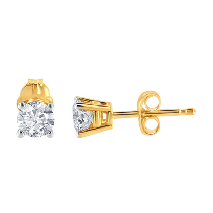 Pair of yellow metal stud earrings with round white gemstones in four-prong settings, shown from front and side angles on a white background.