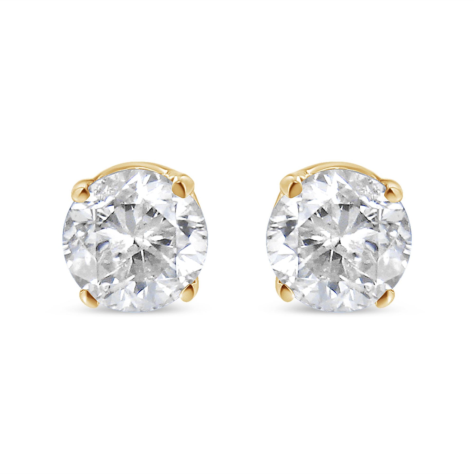 Front view of round white gemstone stud earrings set in yellow metal with four-prong settings, shown against a white background.