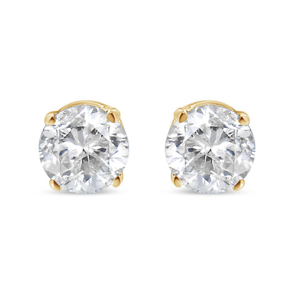 Front view of round white gemstone stud earrings set in yellow metal with four-prong settings, shown against a white background.