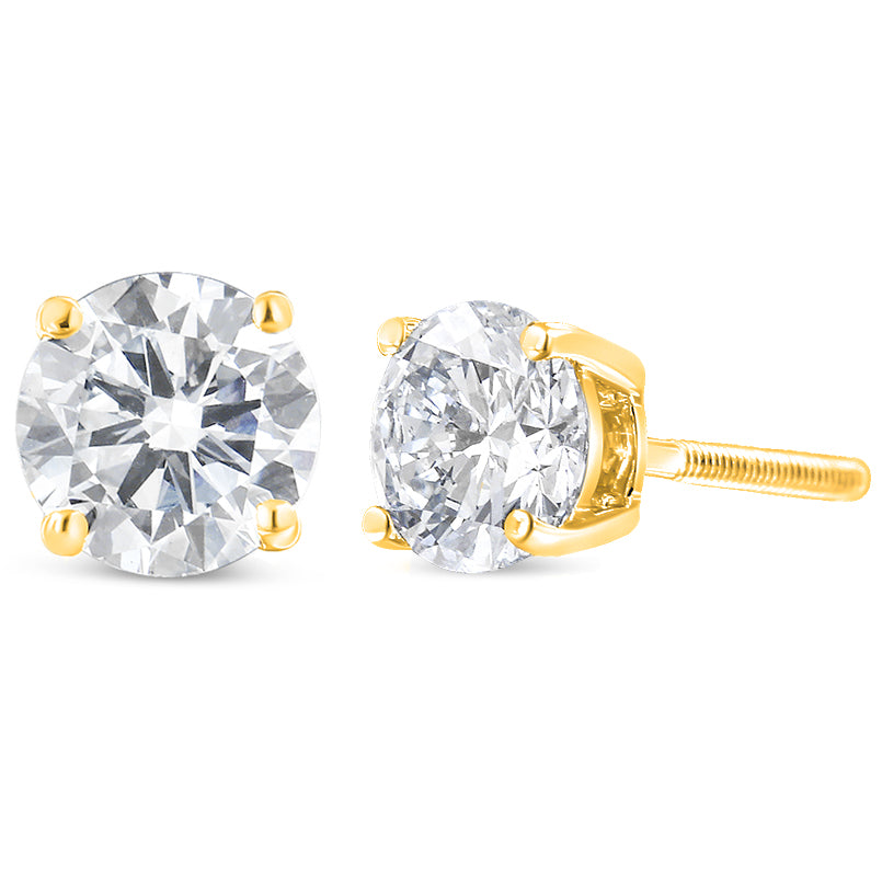 Pair of yellow metal stud earrings with round white gemstones in prong settings, shown from front and side angles on a white background.