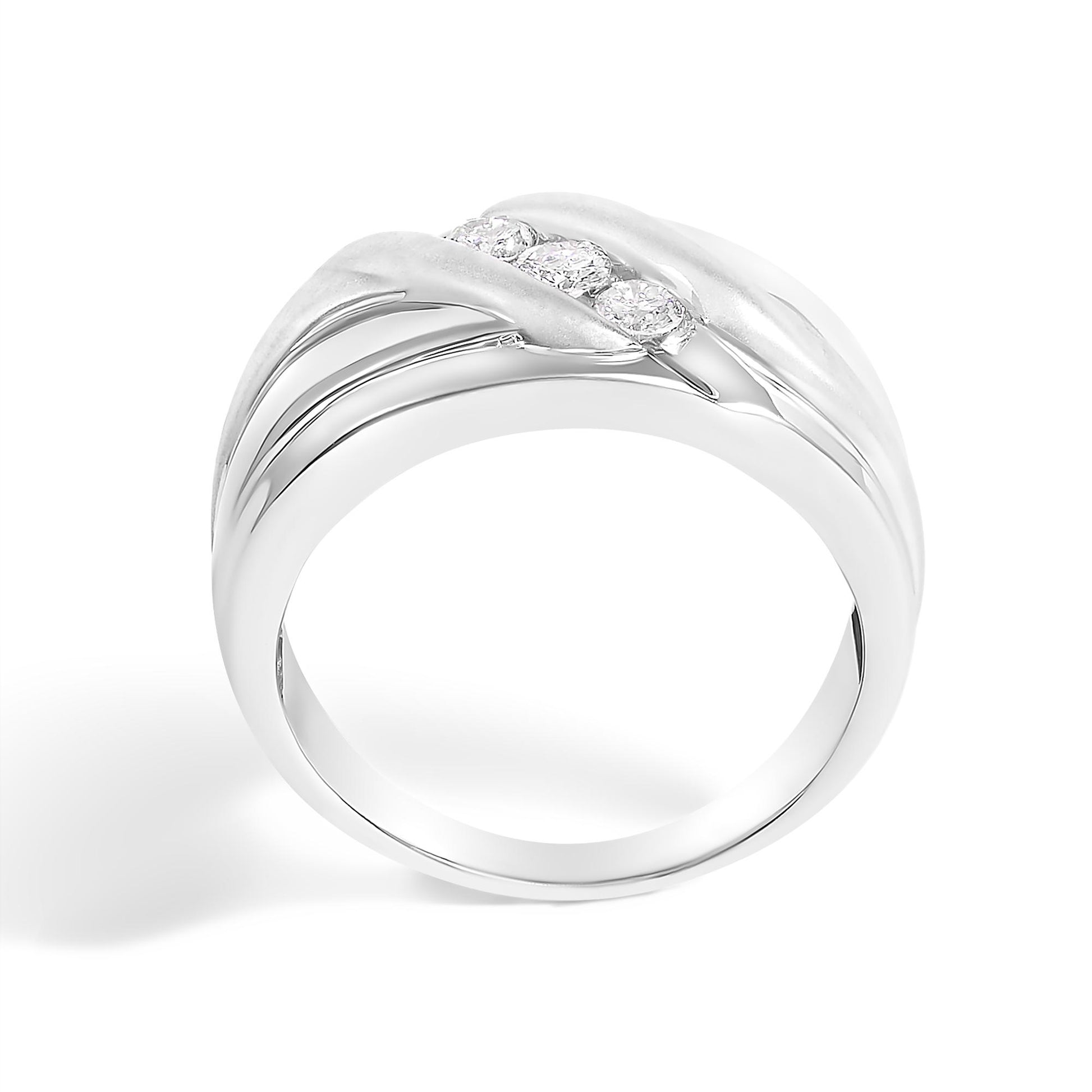 White ring with a smooth and matte finish, featuring three round white gemstones in a channel setting, shown at an angle against a white background.