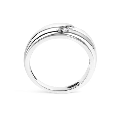 White metal ring with a smooth, slightly twisted band featuring a channel set row of three small round white gemstones, shown in a front-facing angle.